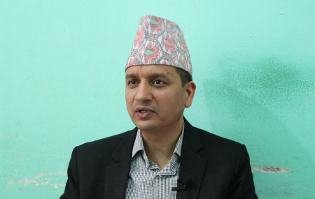 नेपाल राष्ट्र बैंकका प्रवक्ता तथा कार्यकारी निर्देशक गुणाकर भट्ट।